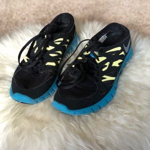 Blue and Yellow Tennis Shoes